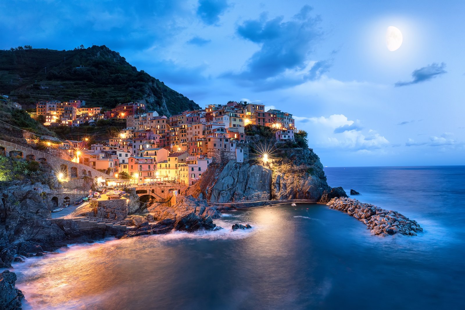 Blue moon and Manarola village at night, Cinque Terre, Italy, Europe